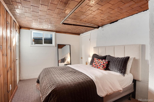 carpeted bedroom featuring brick ceiling