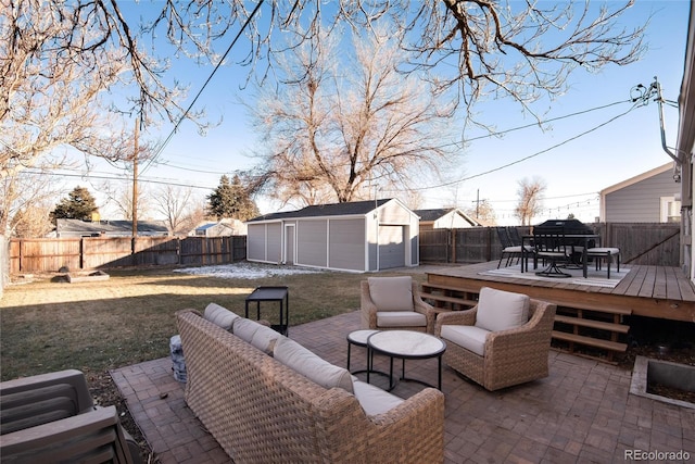 view of patio / terrace with a deck, an outdoor hangout area, and a storage shed