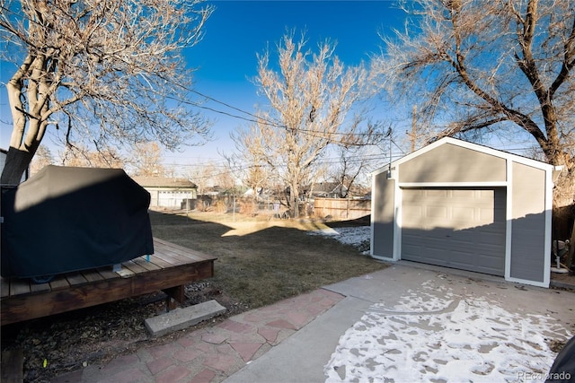 view of yard with a garage and an outdoor structure