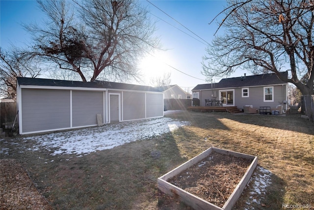 exterior space featuring a deck and a lawn