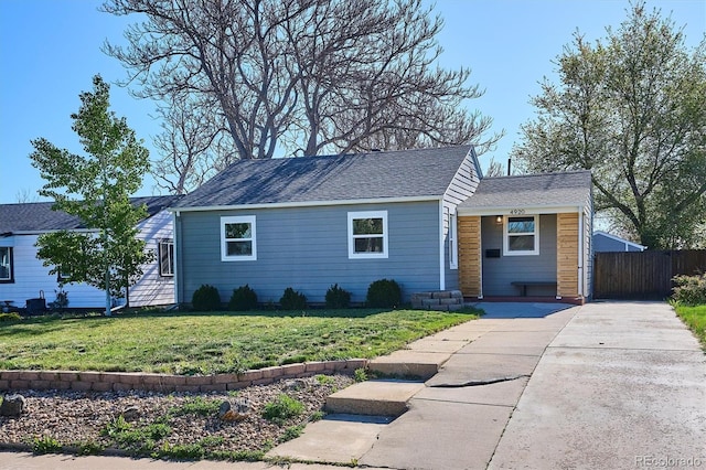 4920 Clay St, Denver, CO 80221 - ranch-style home featuring fence, a shingled roof, and a front yard