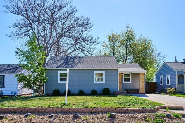 4920 Clay St, Denver, CO 80221 - view of front of house featuring fence, driveway, and a front lawn