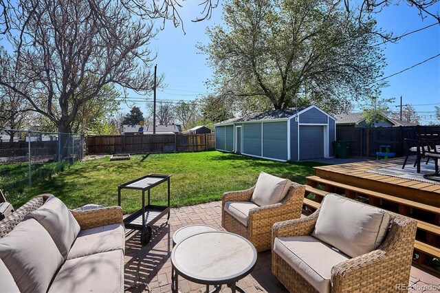 4920 Clay St, Denver, CO 80221 - view of patio / terrace with an outdoor structure, a deck, a fenced backyard, and an outdoor hangout area