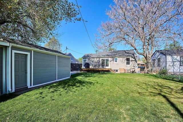 4920 Clay St, Denver, CO 80221 - view of yard with fence, an outbuilding, and a deck