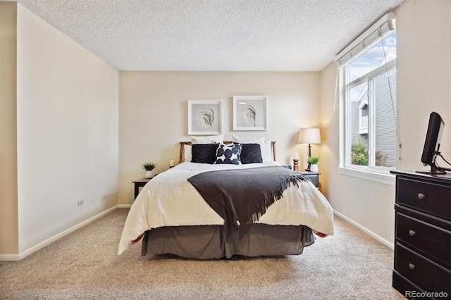 carpeted bedroom with a textured ceiling