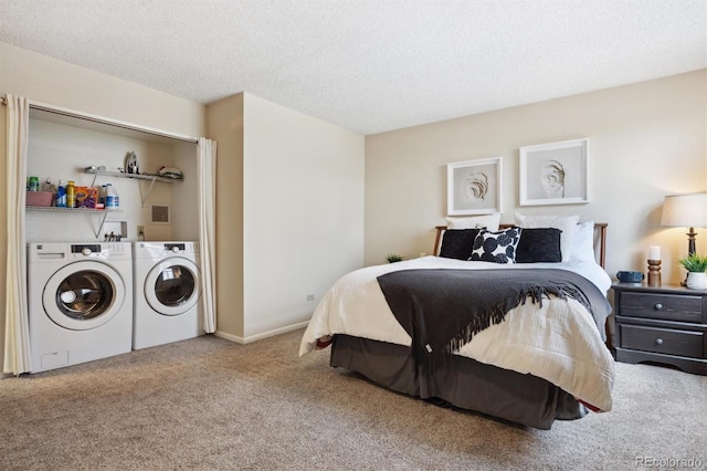 bedroom featuring separate washer and dryer, carpet floors, and a textured ceiling