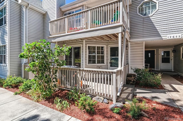 doorway to property featuring a balcony