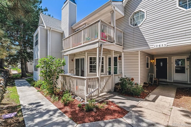 exterior space featuring a balcony