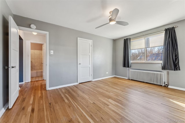 unfurnished bedroom featuring radiator, light wood finished floors, baseboards, and a ceiling fan