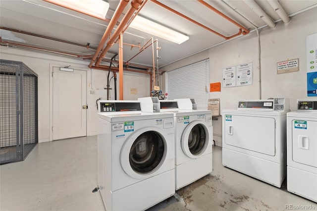 common laundry area with washing machine and clothes dryer