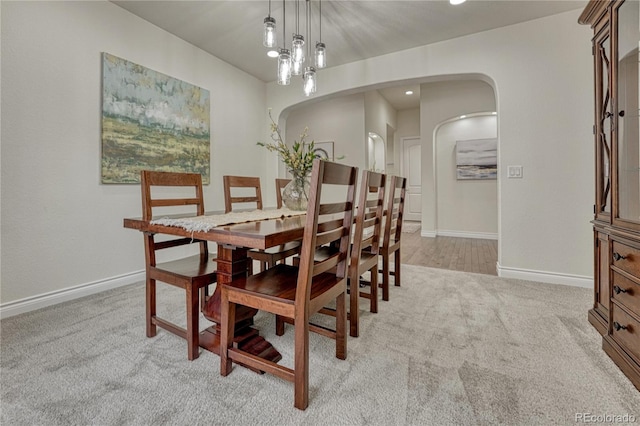 13190 Stone Peaks Way, Peyton, CO 80831 - carpeted dining area featuring arched walkways and recessed lighting