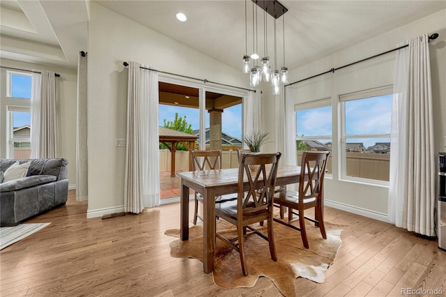 13190 Stone Peaks Way, Peyton, CO 80831 - dining area with light wood-style floors, healthy amount of natural light, recessed lighting, and a chandelier