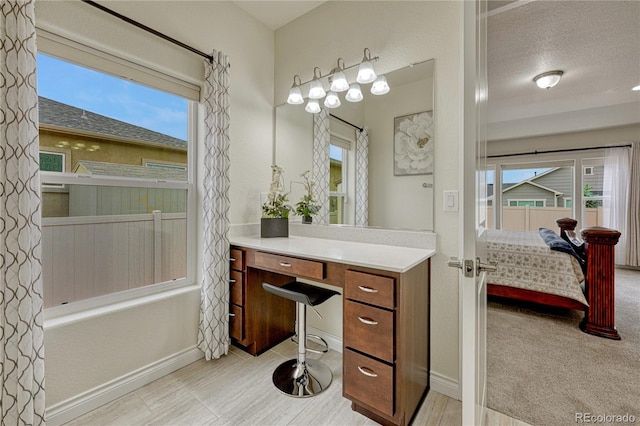 13190 Stone Peaks Way, Peyton, CO 80831 - ensuite bathroom with vanity, plenty of natural light, and shower / washtub combination