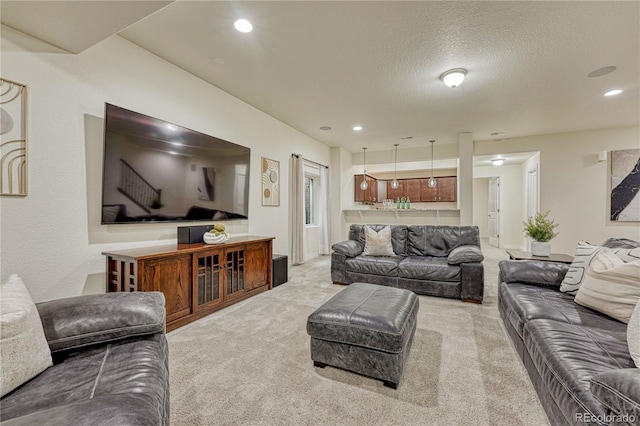13190 Stone Peaks Way, Peyton, CO 80831 - living room featuring carpet, a textured ceiling, and recessed lighting