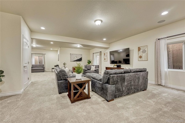 13190 Stone Peaks Way, Peyton, CO 80831 - carpeted living room featuring a textured ceiling and recessed lighting