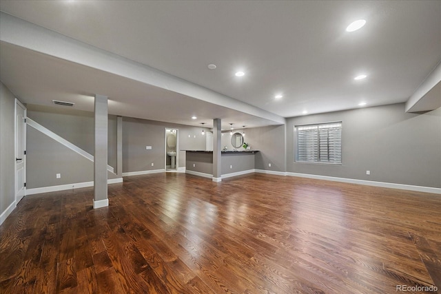 basement with dark wood-type flooring