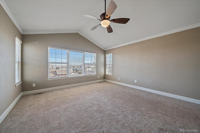 unfurnished room featuring crown molding, vaulted ceiling, ceiling fan, and carpet