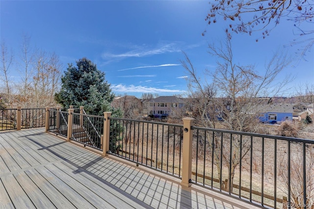 wooden deck with a residential view