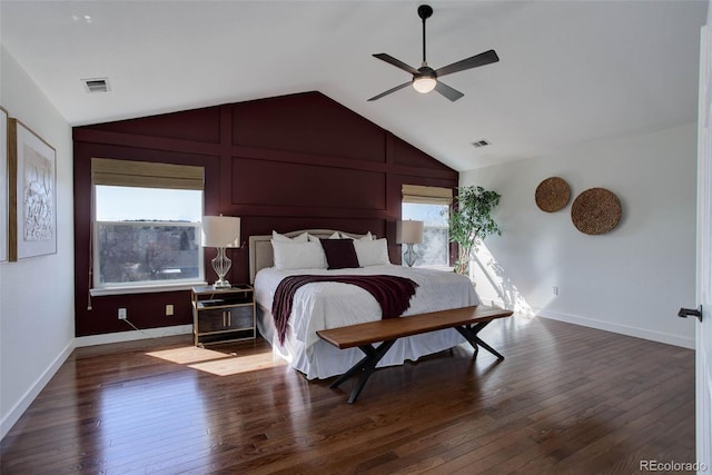 bedroom with visible vents, lofted ceiling, and wood-type flooring