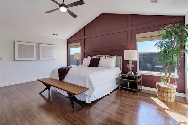 bedroom with multiple windows, visible vents, and wood-type flooring