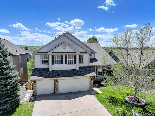 22388 Quail Run Dr, Parker, CO 80138 - view of front facade with stone siding, concrete driveway, an attached garage, a shingled roof, and a front yard