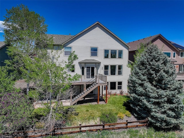 22388 Quail Run Dr, Parker, CO 80138 - rear view of property with stairway, a wooden deck, and roof with shingles