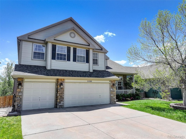 22388 Quail Run Dr, Parker, CO 80138 - view of front of home featuring a garage, concrete driveway, roof with shingles, and stone siding