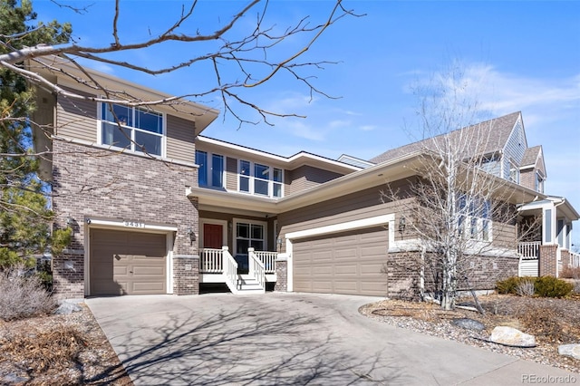 view of front facade featuring driveway and brick siding