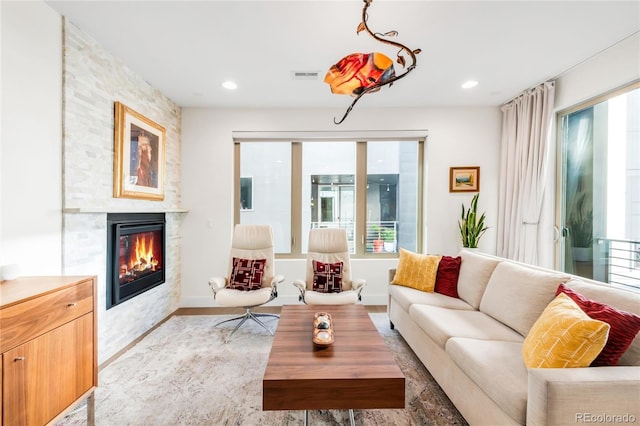 1333 Elati St Unit 1, Denver, CO 80204 - living area featuring a fireplace, recessed lighting, light wood-style flooring, and visible vents