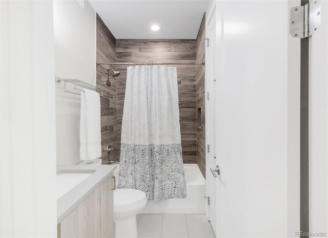 1333 Elati St Unit 1, Denver, CO 80204 - full bath featuring tile patterned flooring, vanity, toilet, recessed lighting, and shower / tub combo