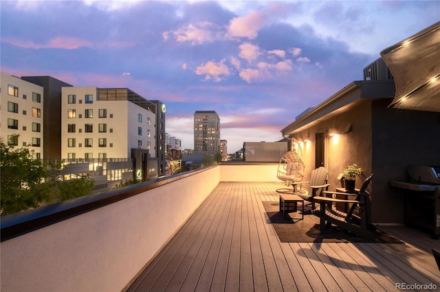 1333 Elati St Unit 1, Denver, CO 80204 - deck at dusk featuring a view of city