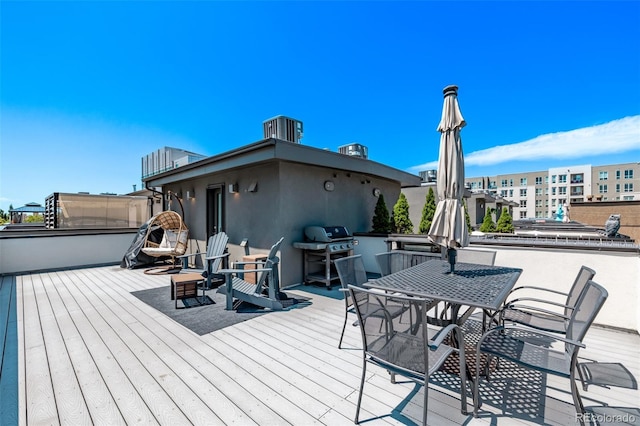 1333 Elati St Unit 1, Denver, CO 80204 - wooden terrace featuring a grill and outdoor dining space