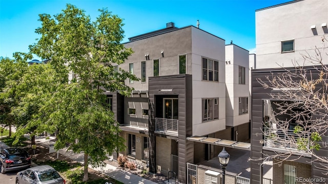 1333 Elati St Unit 1, Denver, CO 80204 - view of front of house featuring stucco siding