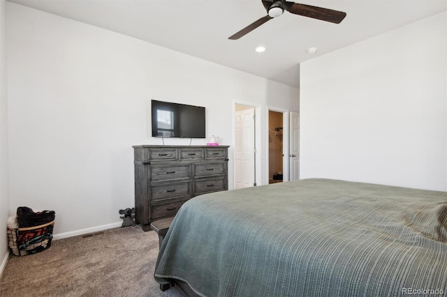 bedroom featuring light colored carpet and ceiling fan