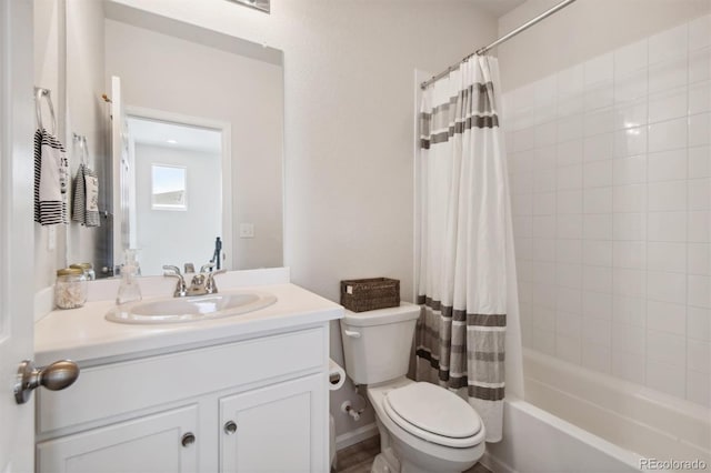 full bathroom with vanity, shower / bathtub combination with curtain, and toilet