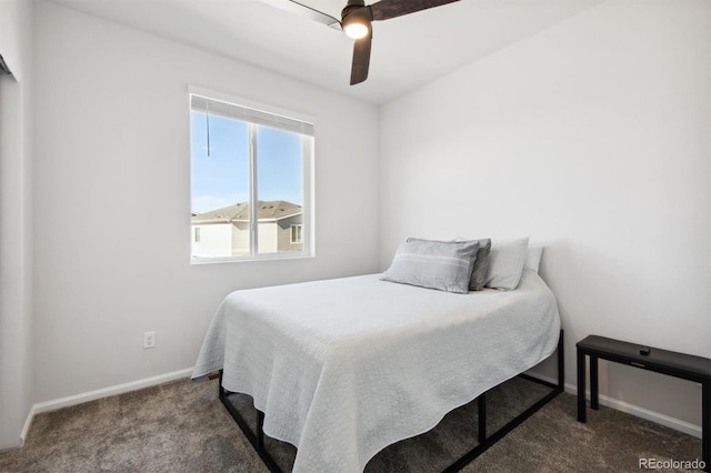 bedroom featuring ceiling fan and carpet