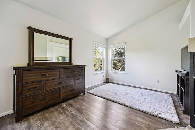 5465 Broadmoor Bliff Dr, Colorado Springs, CO 80904 - bedroom featuring vaulted ceiling, baseboards, and dark wood finished floors