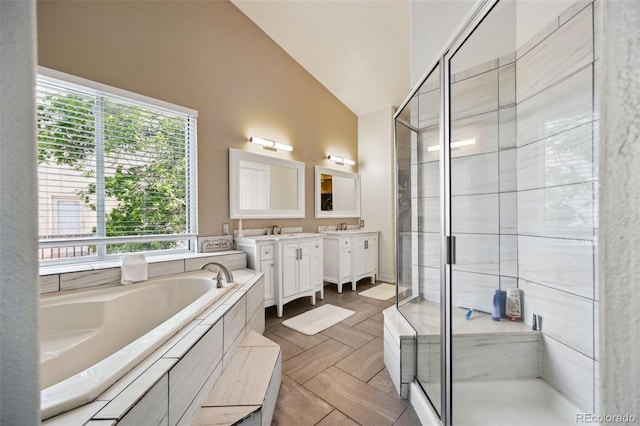 5465 Broadmoor Bliff Dr, Colorado Springs, CO 80904 - full bath with double vanity, lofted ceiling, a shower stall, and a bath