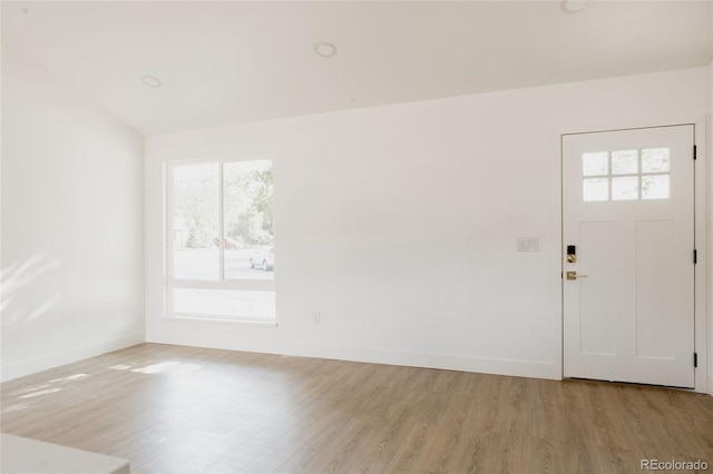 spare room with light wood-type flooring