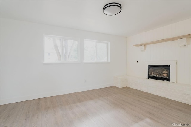 unfurnished living room with light hardwood / wood-style floors