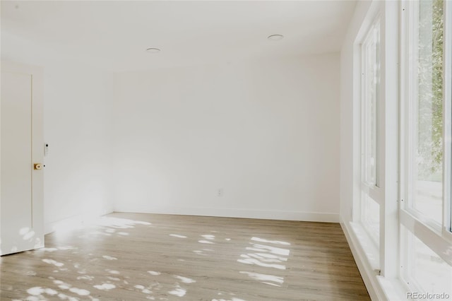 unfurnished room with light hardwood / wood-style flooring