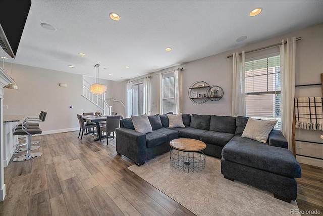 21392 E Stroll Ave, Parker, CO 80138 - living area with wood finished floors, recessed lighting, and stairs