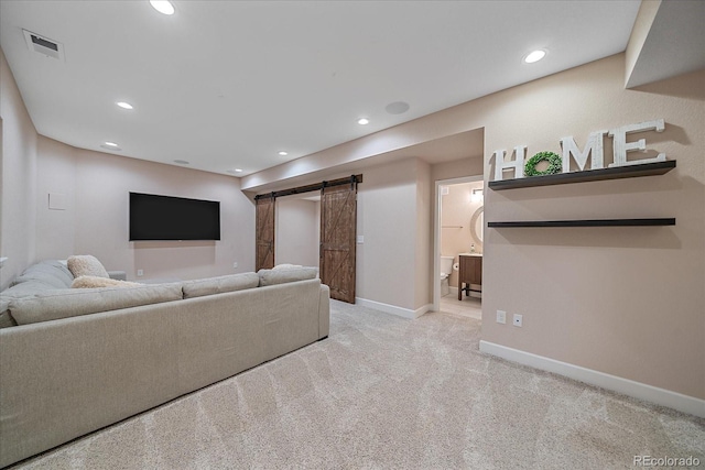 21392 E Stroll Ave, Parker, CO 80138 - carpeted living room featuring a barn door and recessed lighting