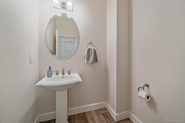 21392 E Stroll Ave, Parker, CO 80138 - bathroom featuring wood finished floors and baseboards