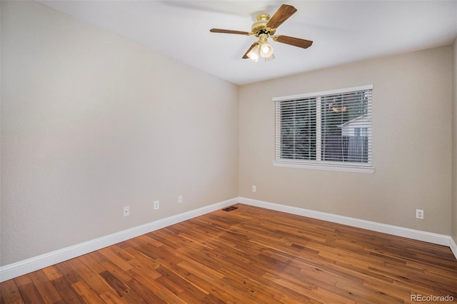 empty room featuring wood-type flooring and ceiling fan