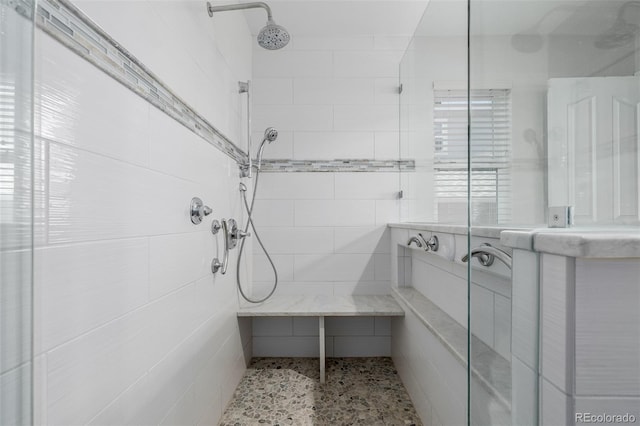 bathroom with a tile shower