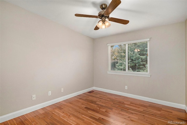 empty room featuring wood-type flooring and ceiling fan