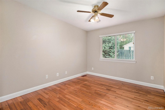 unfurnished room with hardwood / wood-style floors and ceiling fan