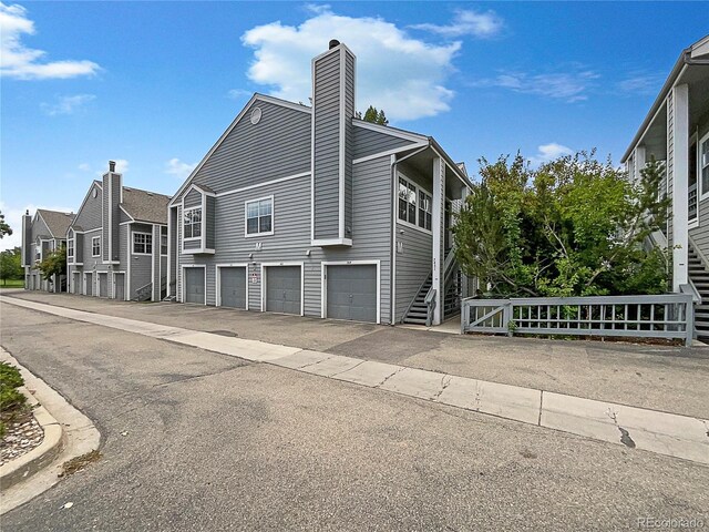 view of side of home with a garage