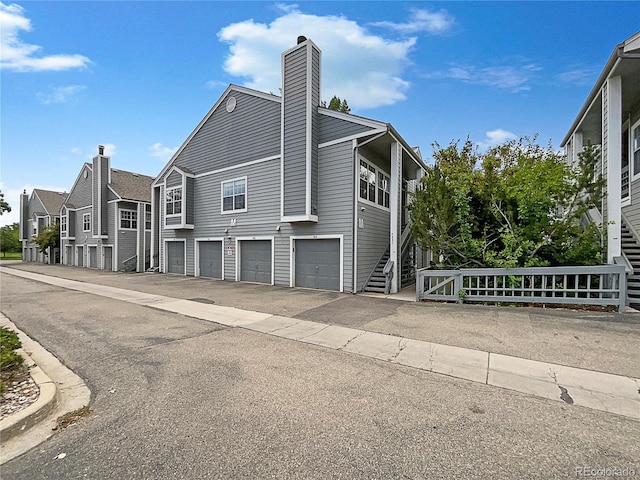 view of side of property with a garage